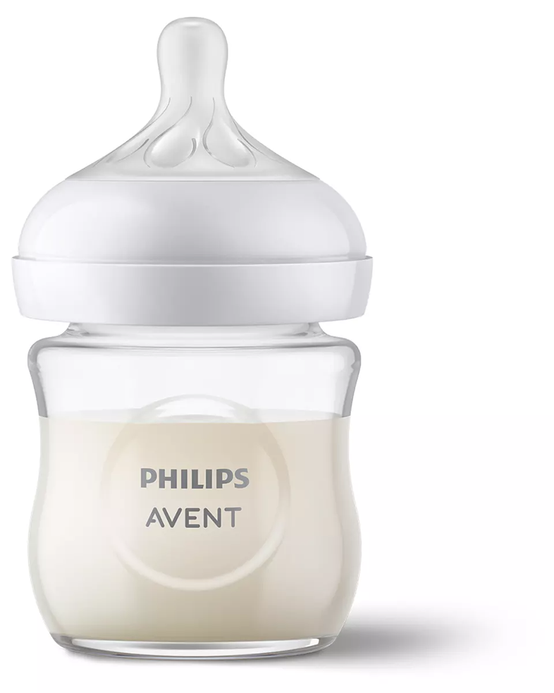 Tejjel töltött cumisüveg, átlátszó üveg, fehér fedél és cumi. Philips Avent logó látható.