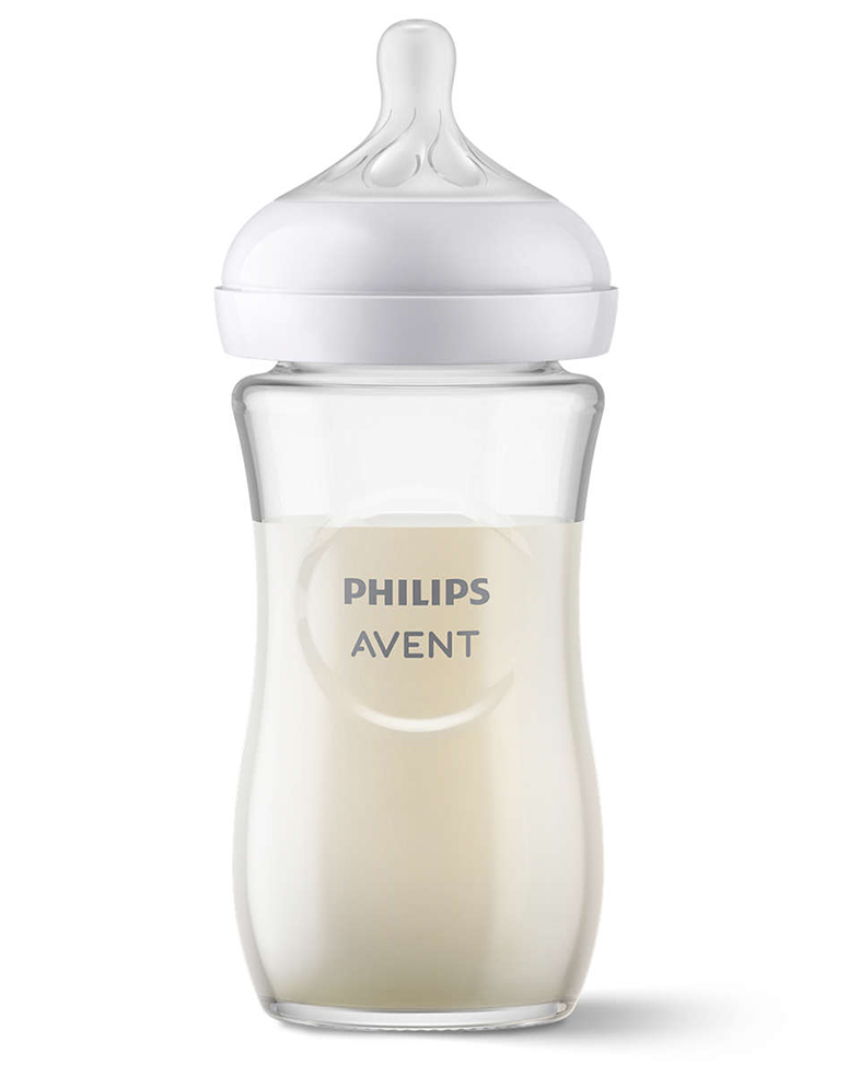 Átlátszó Philips Avent cumisüveg tejjel töltve, fehér cumival.