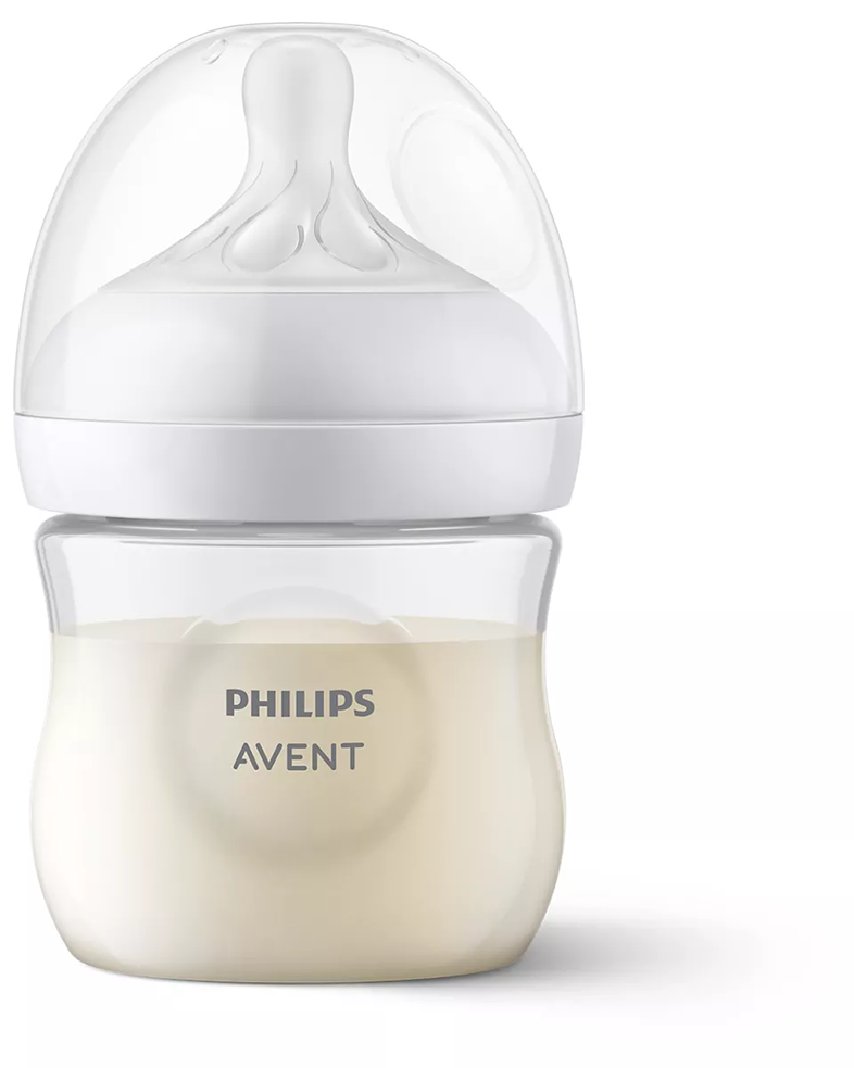 Egy fehér bébiüveg átlátszó cumival, ami tejet tartalmaz. A palackon a PHILIPS AVENT felirat látható.