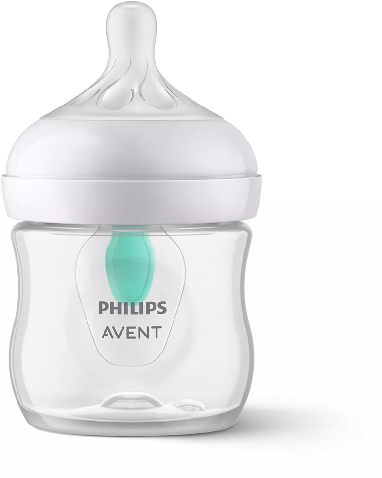 Átlátszó Philips Avent bébiüveg fehér kupakkal és zöld cumival, fehér háttéren.