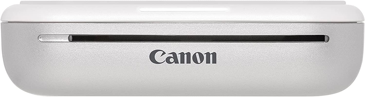 Una impresora fotográfica Canon plateada con el logotipo de Canon en la parte delantera.