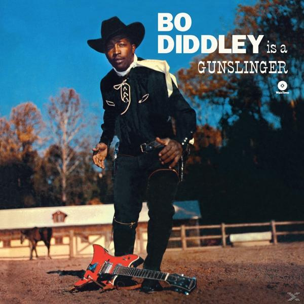 Album borító Bo Diddley-vel cowboy kalapban és gitárral. Kék ég, egy ló a háttérben.