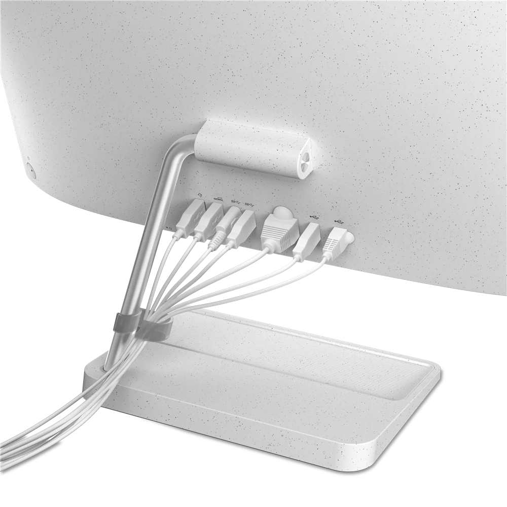 Vista trasera de un monitor de computadora blanco con varios cables conectados.