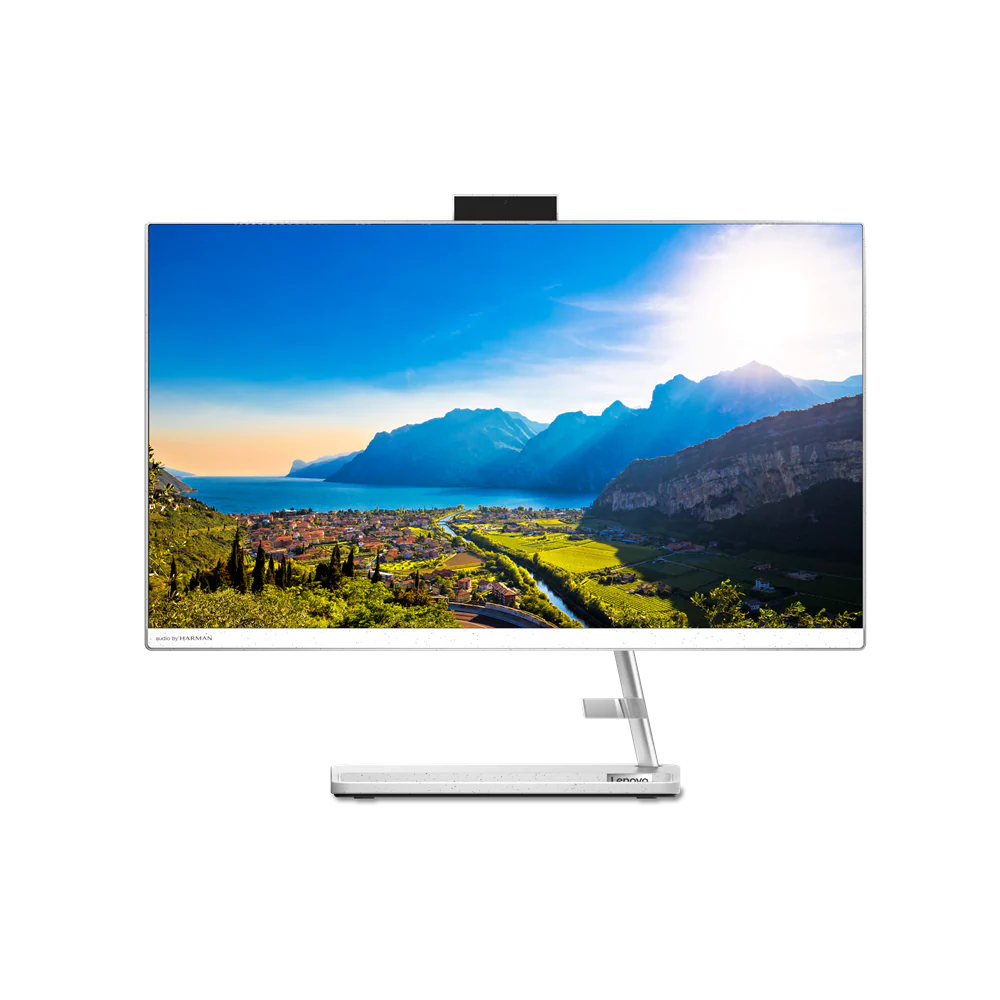 Un monitor de computadora con una imagen de paisaje de montañas, un lago y una ciudad, en un fondo negro.