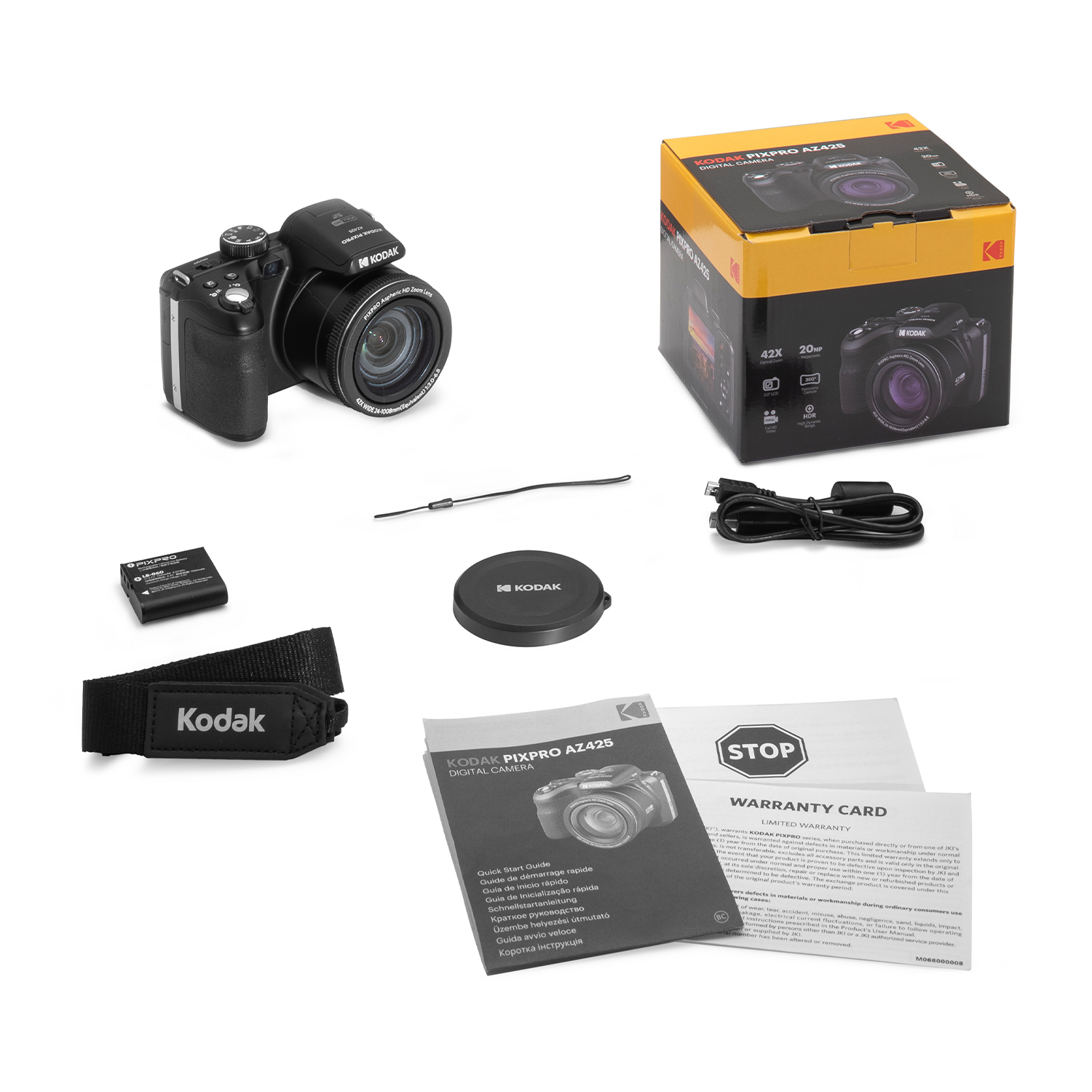 Una scatola aperta con una fotocamera, accessori e manuali.