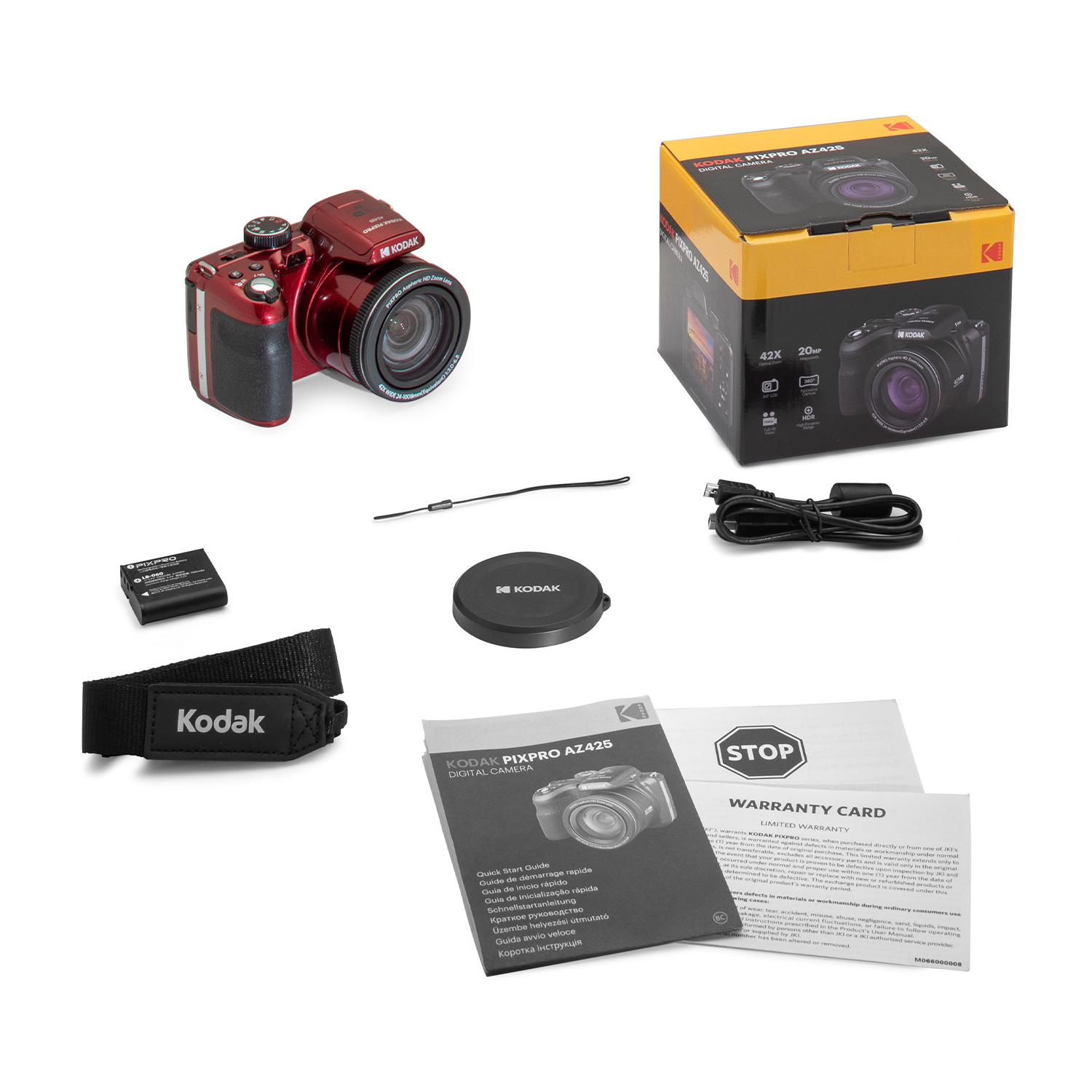 Kit fotocamera Kodak PixPro AZ425 con fotocamera, scatola, accessori e istruzioni su superficie bianca.