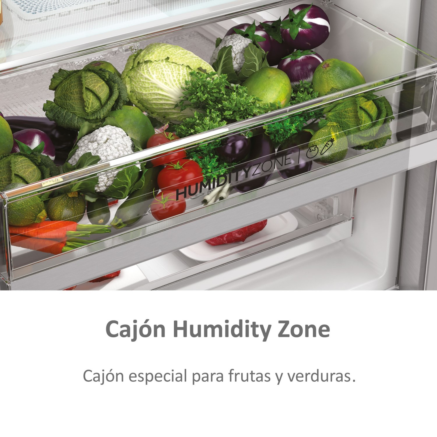 Cajón de refrigerador lleno de verduras frescas. Texto en español visible.