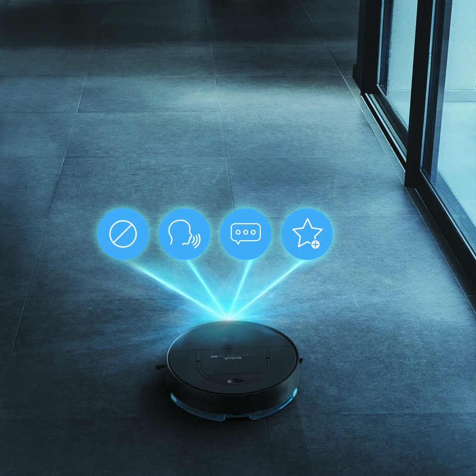 Zeminde üzerinde dört simge yüzen bir robot süpürge.