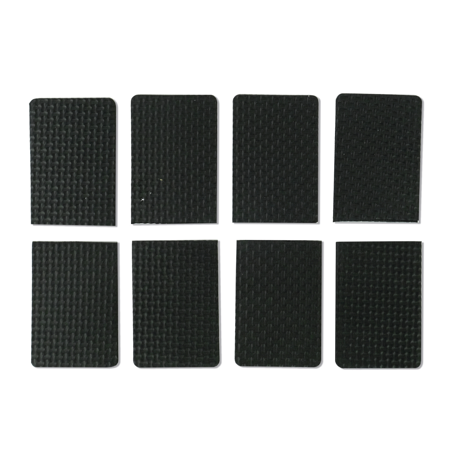 Eight rectangular black pads arranged in a grid pattern. The pads have a textured surface.