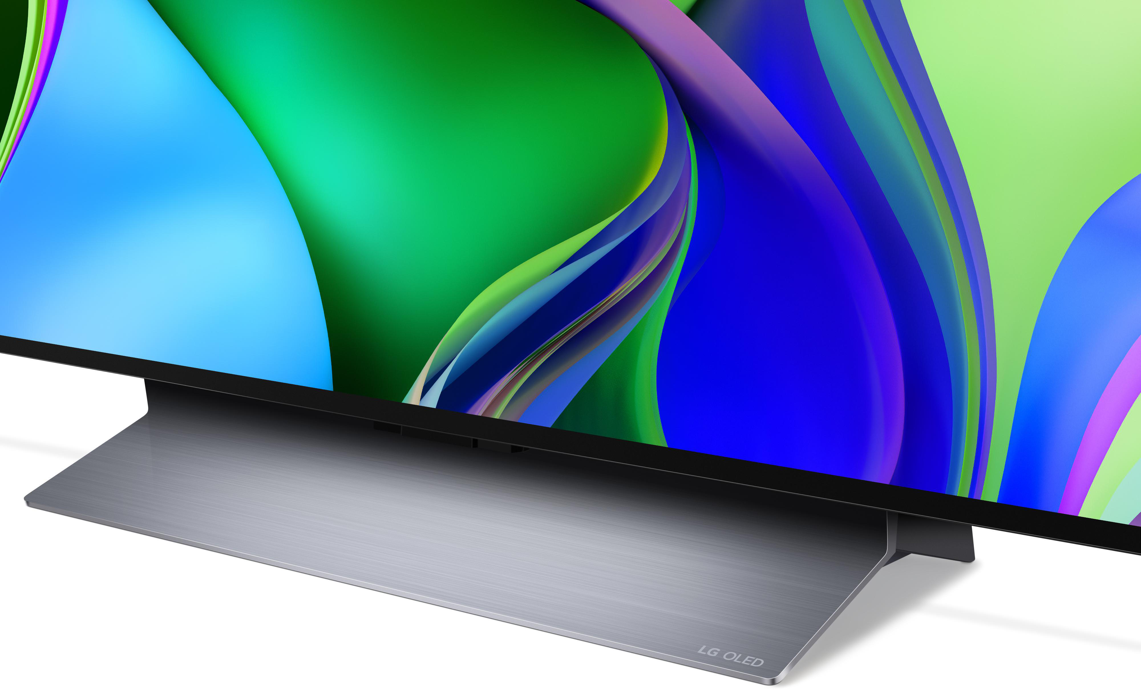 Nahaufnahme eines LG OLED TV-Sockels mit farbenfrohem Bildschirm.