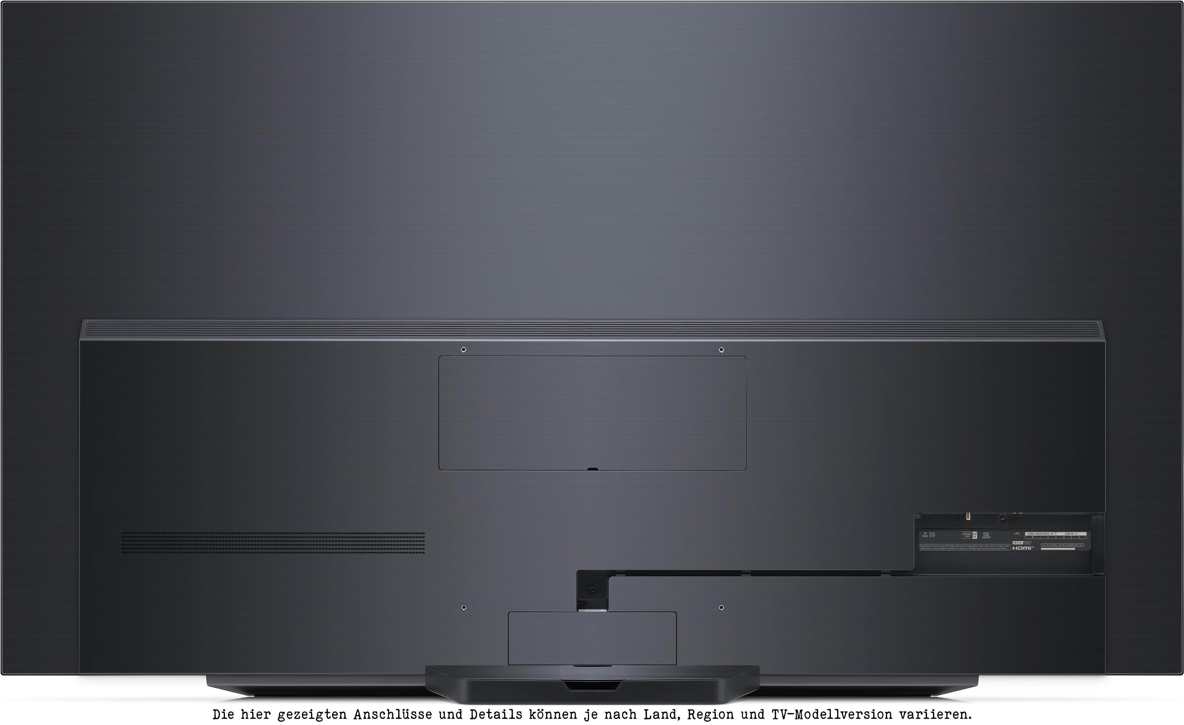 Rückseite eines schwarzen Fernsehers mit Anschlüssen und Details.