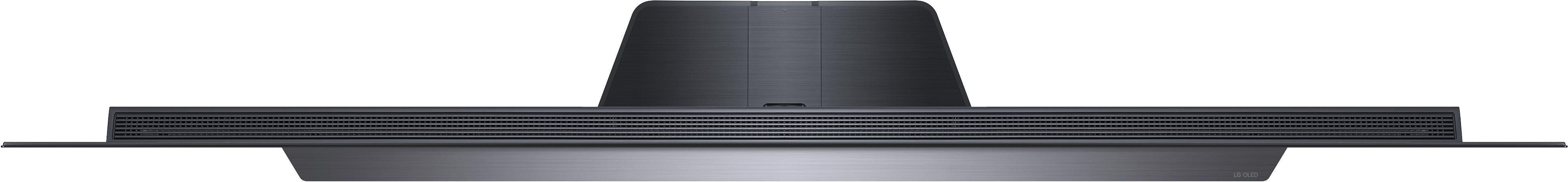 Schwarzer Fernseher, Draufsicht. Zeigt Design mit Lüftungsschlitzen und Netzkabel.