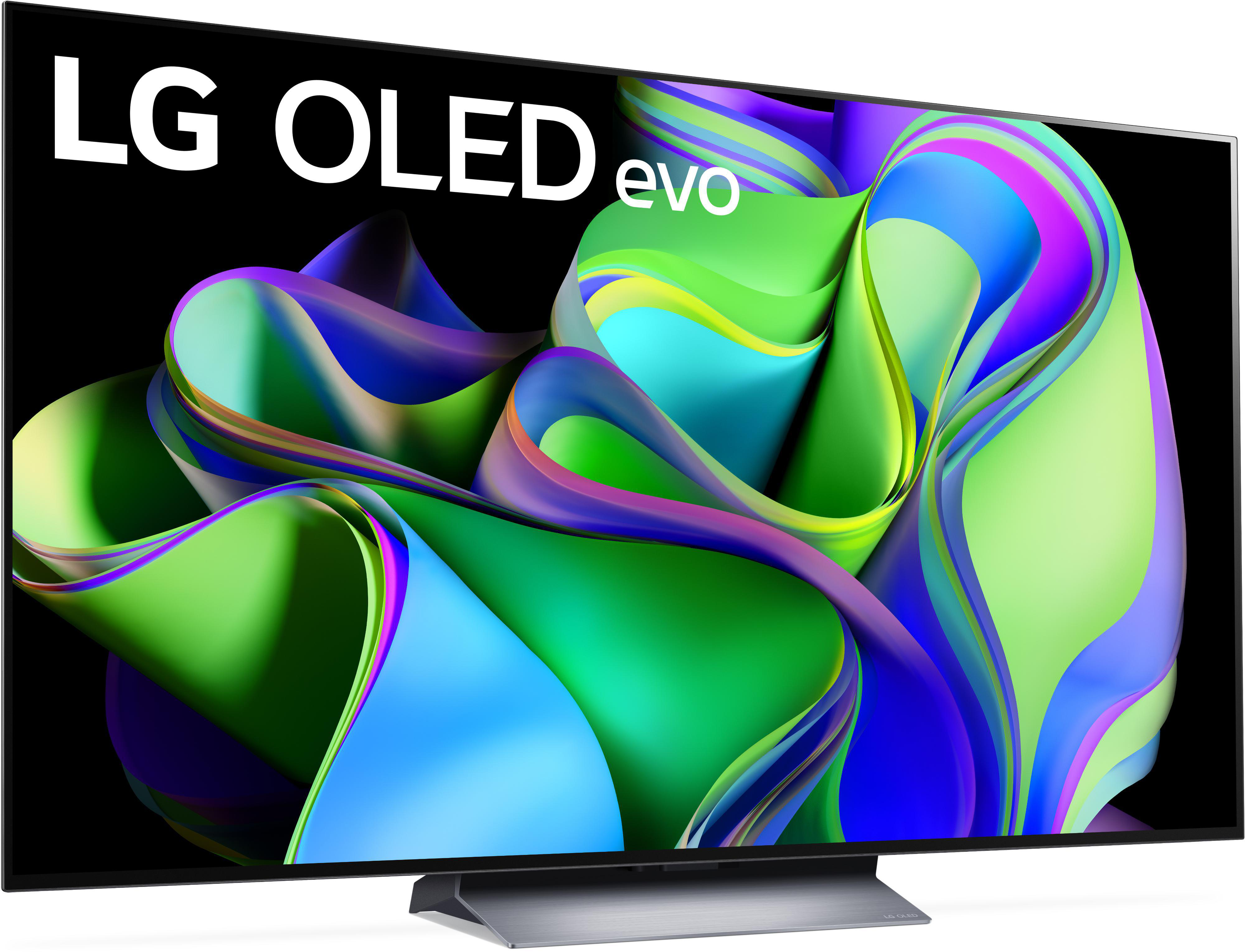 Ein LG OLED evo Fernseher zeigt bunte abstrakte Formen. Der Bildschirm ist schwarz. Der Fernseher hat einen silbernen Standfuß.