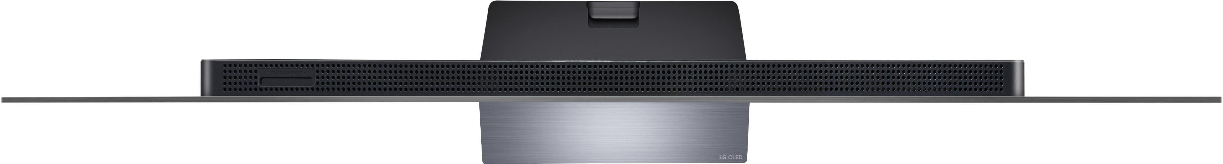 Draufsicht auf einen schwarzen Fernseher mit silbernem Sockel, mit Lüftungsschlitzen.