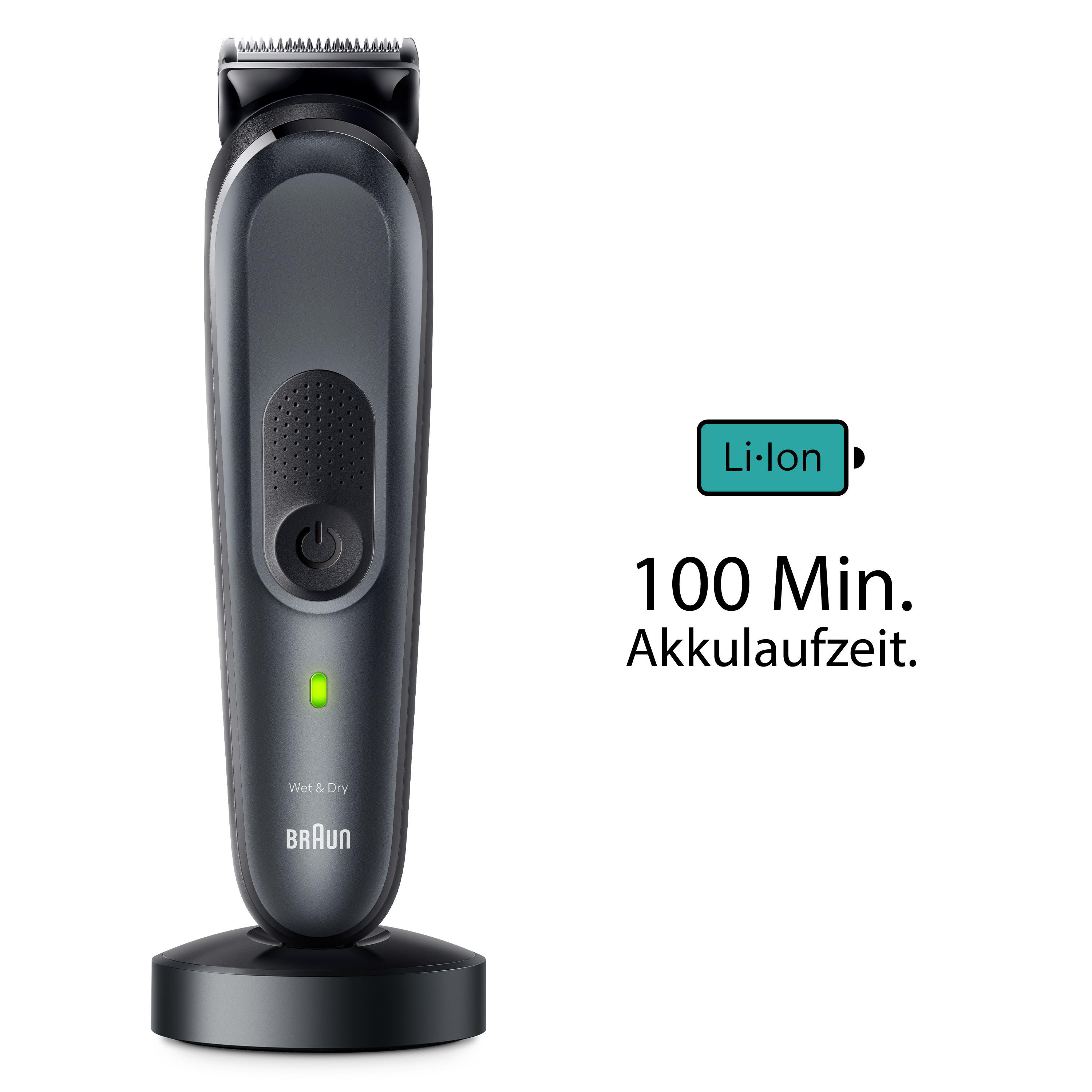 Schwarz-grauer Trimmer mit Ladestation und grüner Betriebsanzeige.