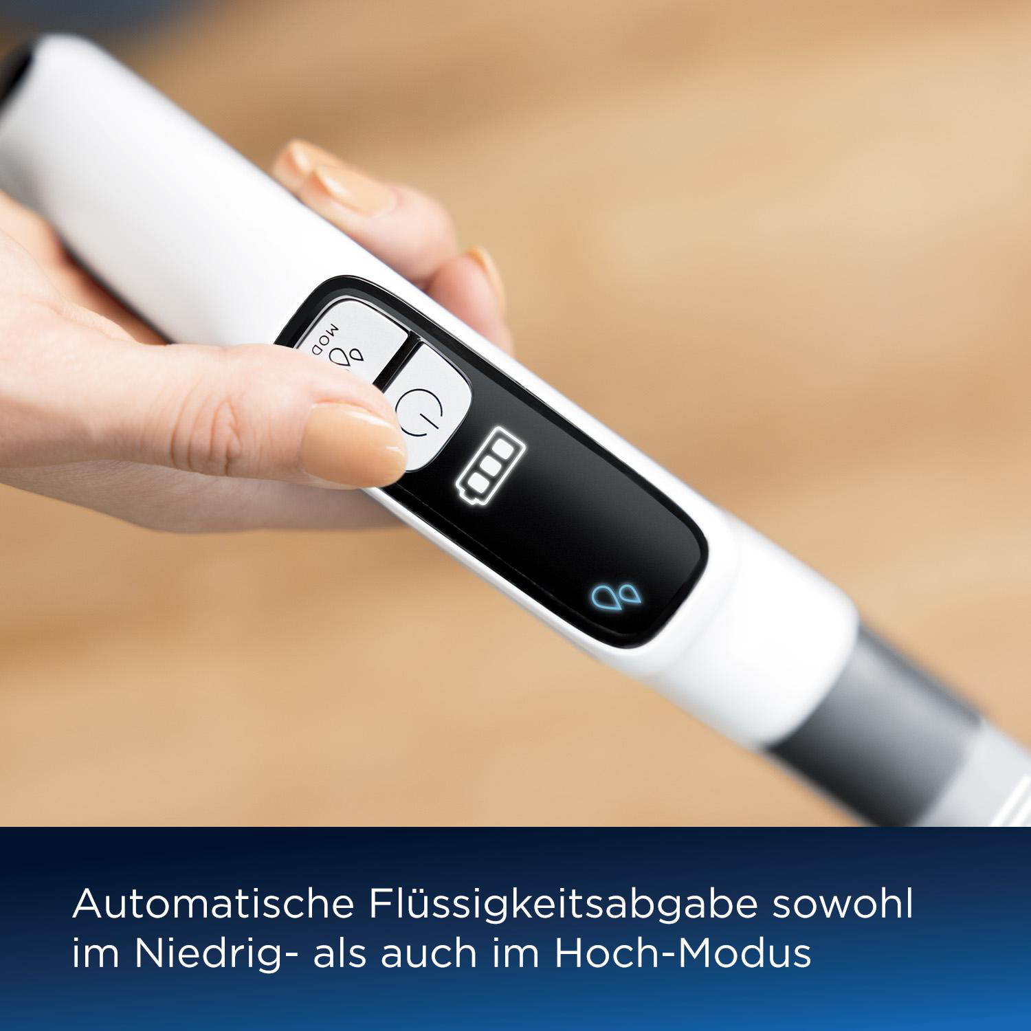 Eine Hand drückt einen Knopf auf einem weißen Gerät. Der Bildschirm zeigt ein Batteriesymbol. Text unten: 'automatische Flüssigkeitsabgabe'.