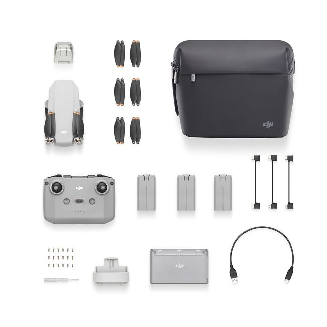 Kit de dron con dron, mando, baterías, cargador, hélices y estuche de transporte.