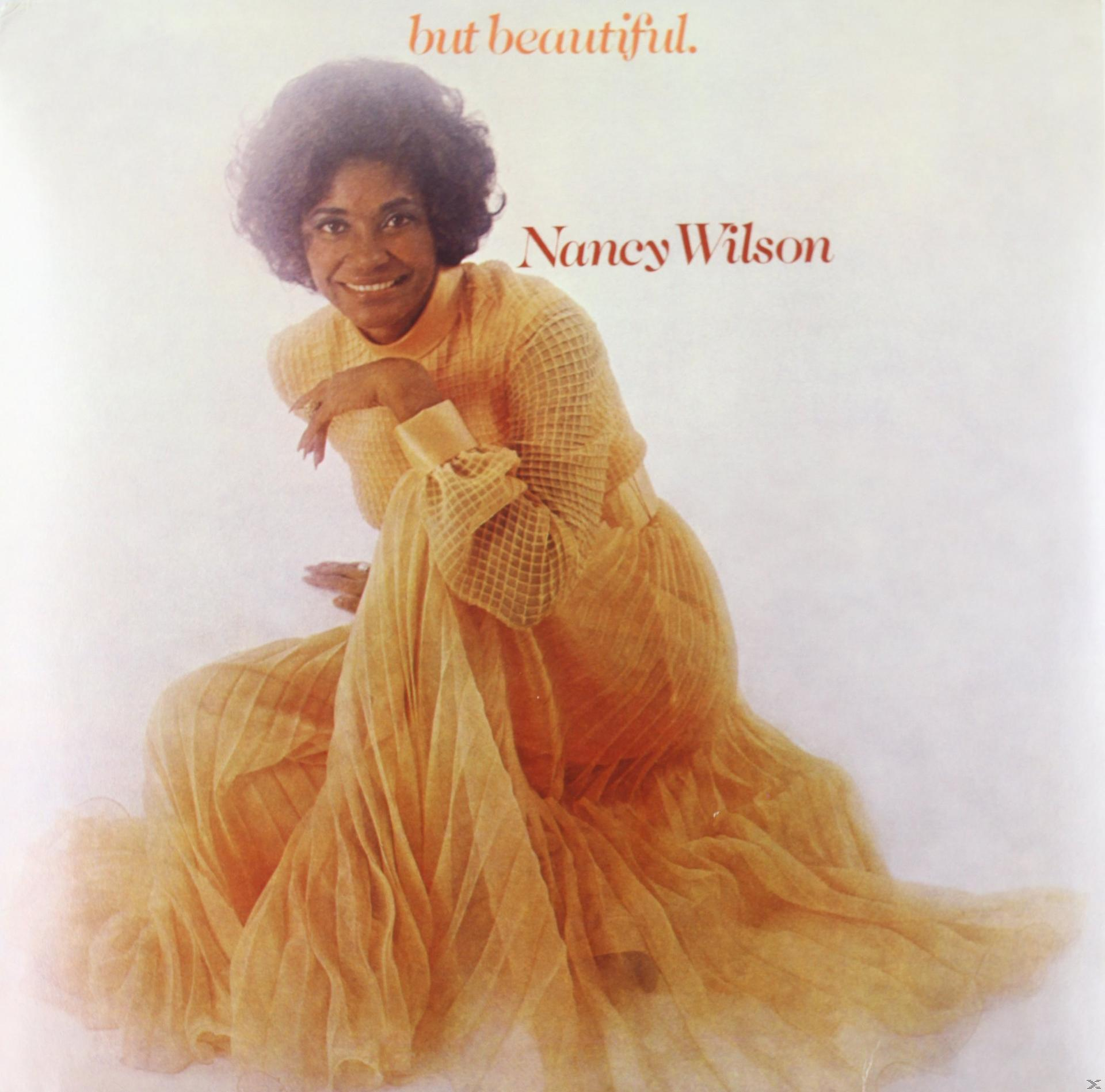 Nancy Wilson album borítója. Narancssárga ruhában, mosolyog. A szöveg: 'but beautiful' és a neve.