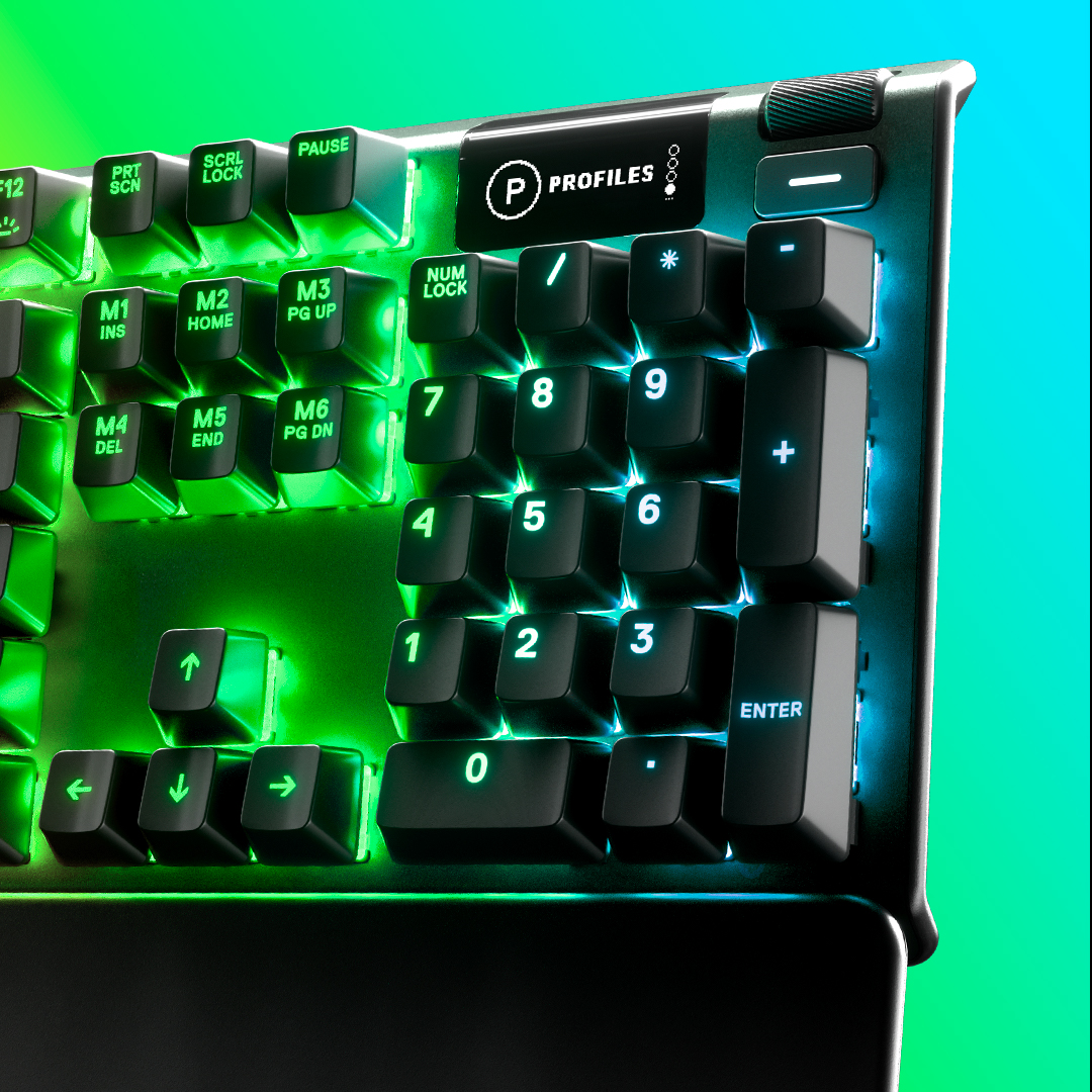Yeşil ve mavi ışıklı, arkadan aydınlatmalı bir klavyenin yakın çekimi. Tuşlar siyah.