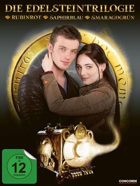 DVD-Cover: Paar umarmt sich, goldgerahmte Uhr, deutscher Titel 'Die Edelsteintrilogie'.