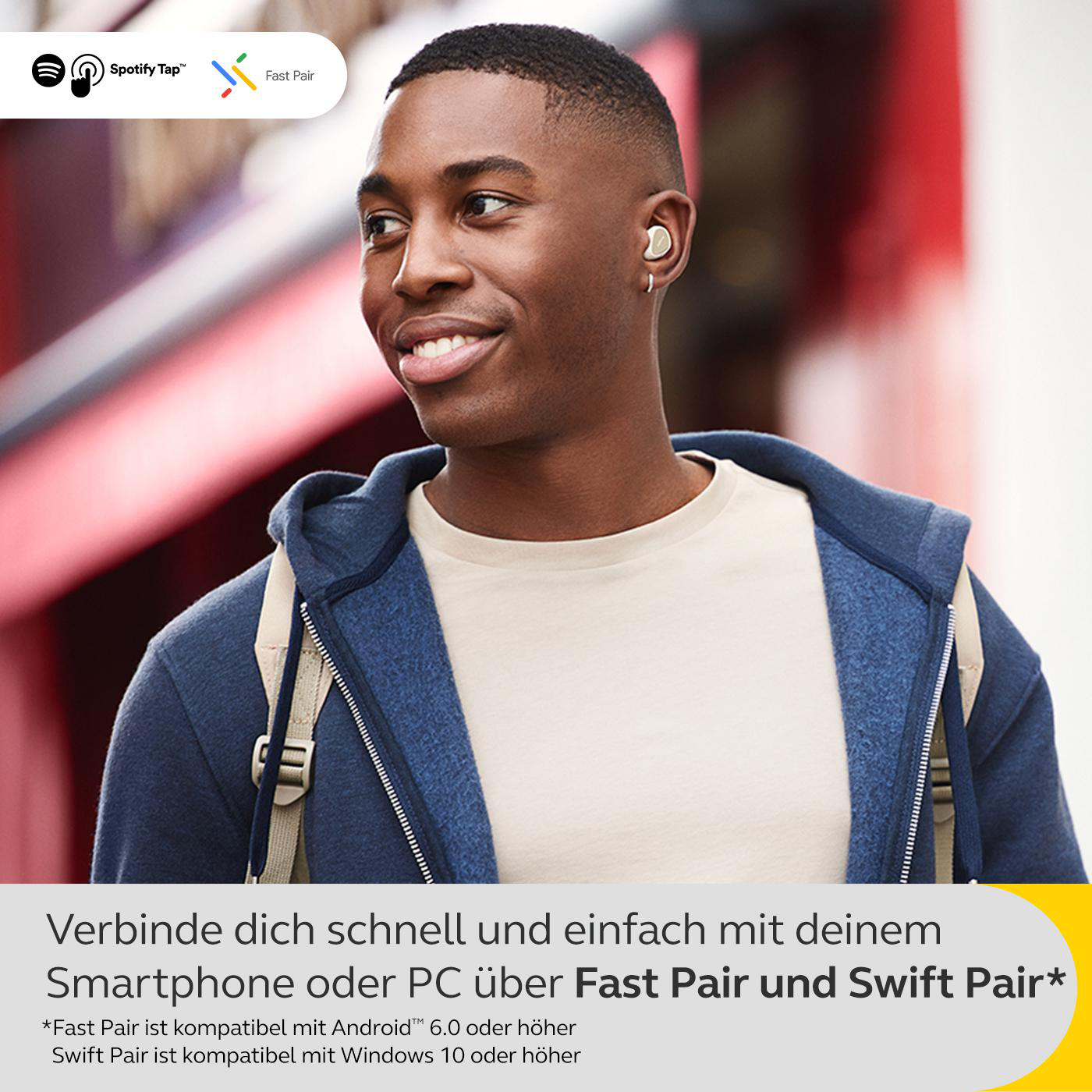 Ein Mann mit Ohrhörern lächelt, mit Text 'Fast Pair' und 'Spotify Tap' und Produktinformationen.