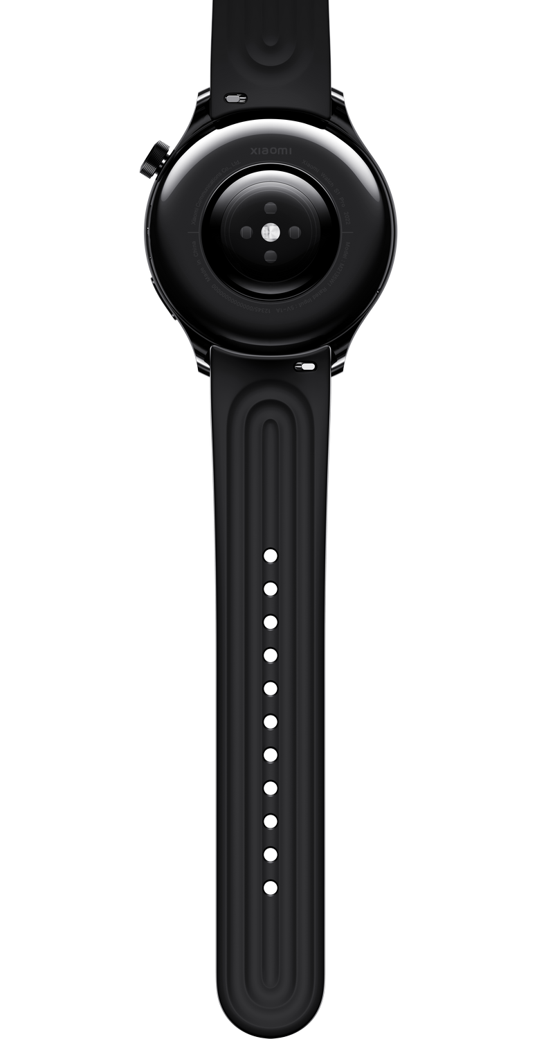 Vista trasera de un reloj inteligente negro con correa negra. Fondo negro.