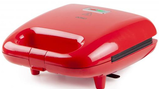 A red sandwich maker with a handle and indicators on top.