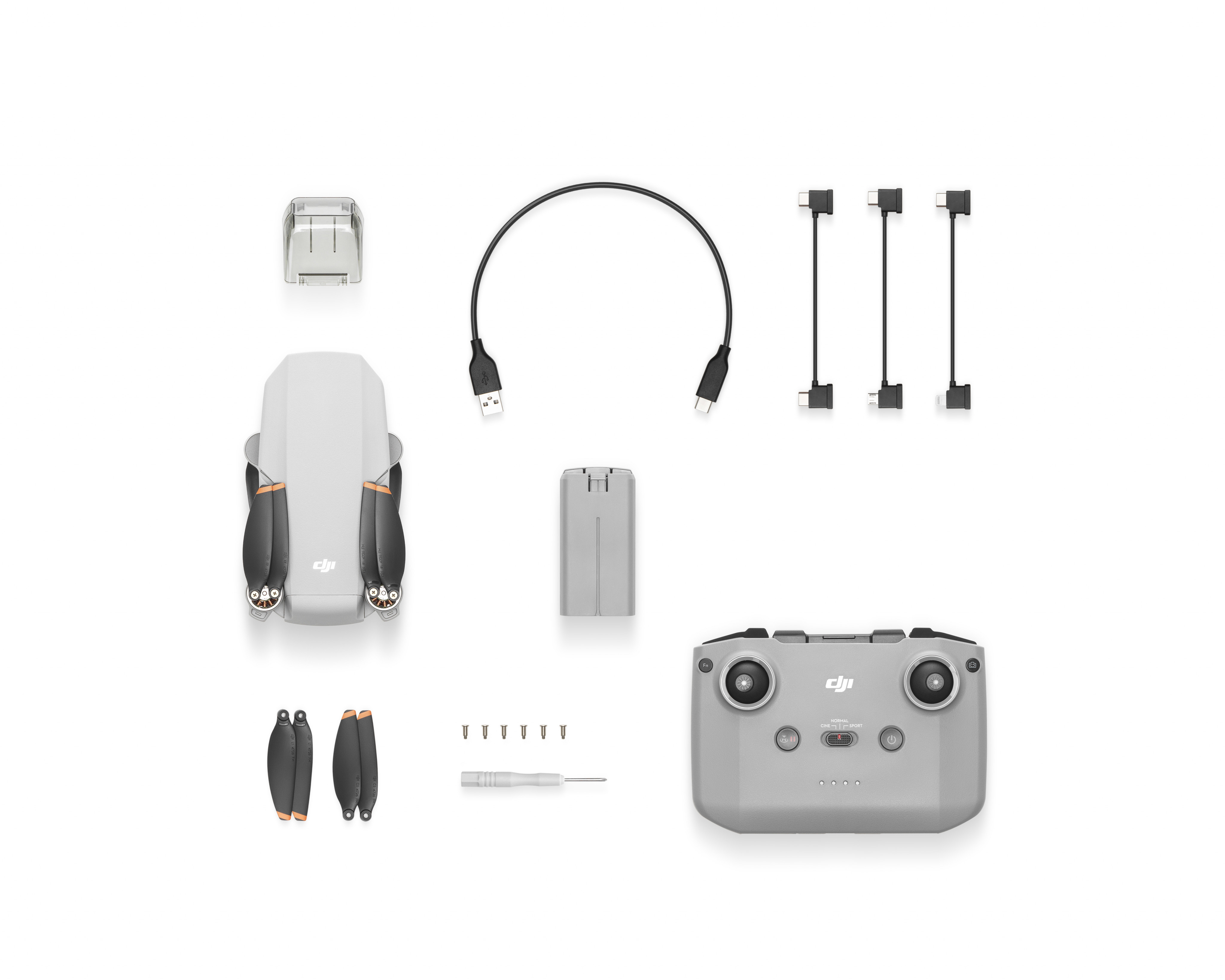 Drón és tartozékai, beleértve a távirányítót, USB kábelt és pótalkatrészeket.