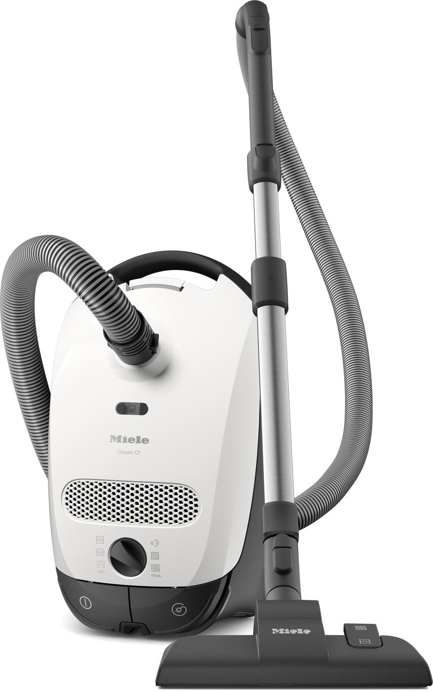 Weißer Miele-Staubsauger mit grauem Schlauch und Griff. Schwarze Bürste unten.