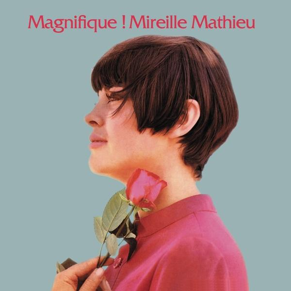 Profilban egy nő rózsát tart. A szöveg azt mondja: 'Magnifique! Mireille Mathieu'.