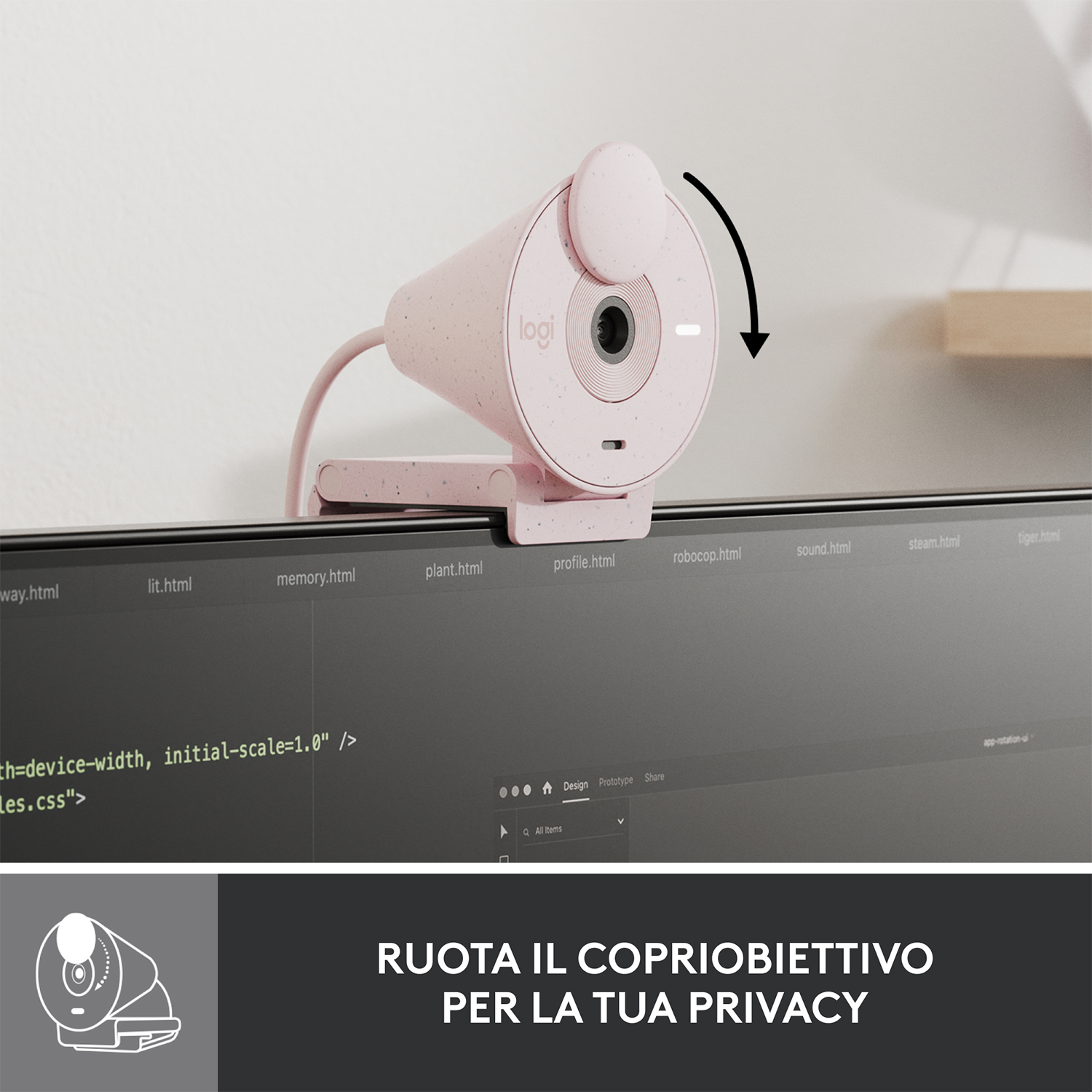 Webcam rosa sopra un monitor. Il copriobiettivo viene ruotato per coprire l'obiettivo.