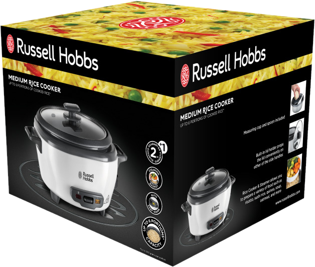 Boîte du cuiseur à riz Russell Hobbs. Cuiseur blanc à l'intérieur. La boîte est imprimée avec des images et du texte.