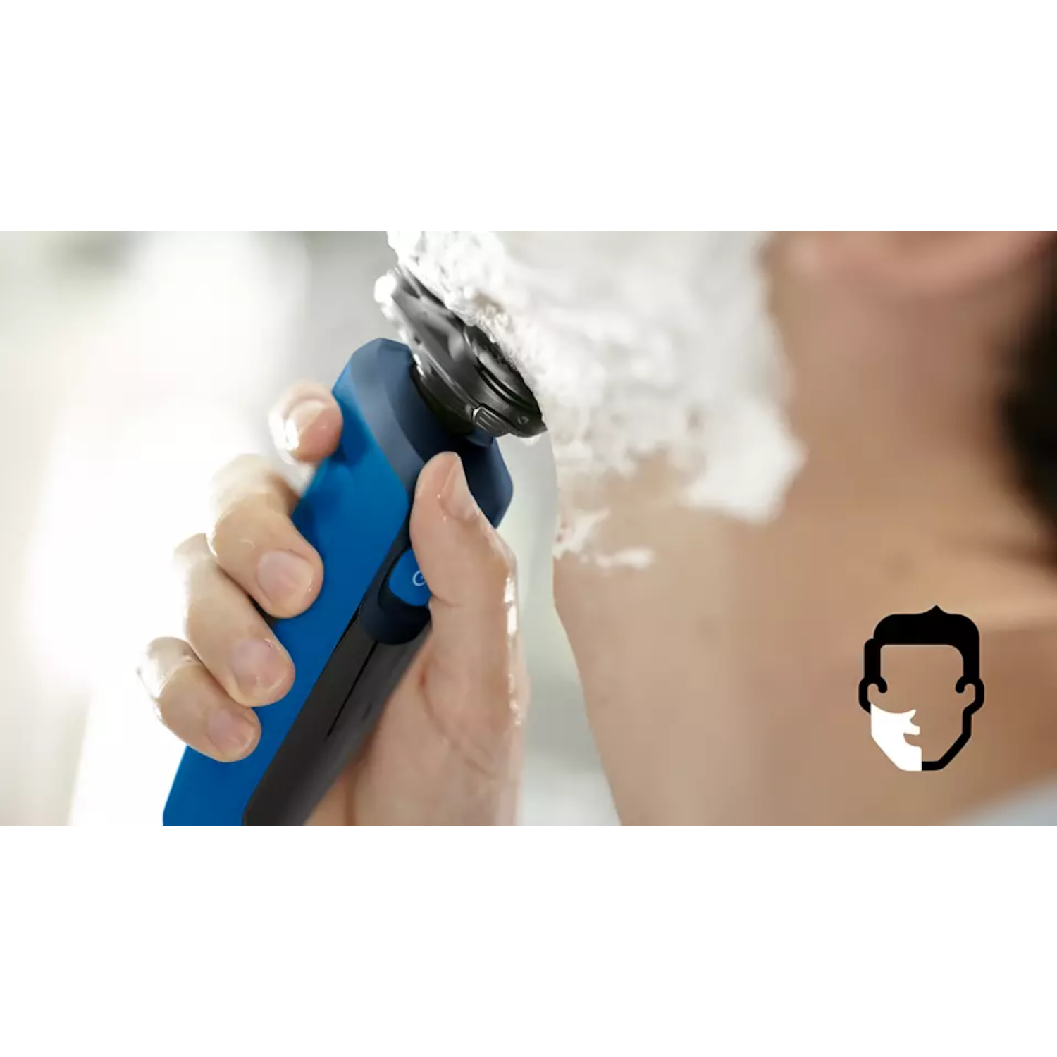 A person shaves their neck with an electric shaver. Shaving foam is visible. A side profile of a face is shown.