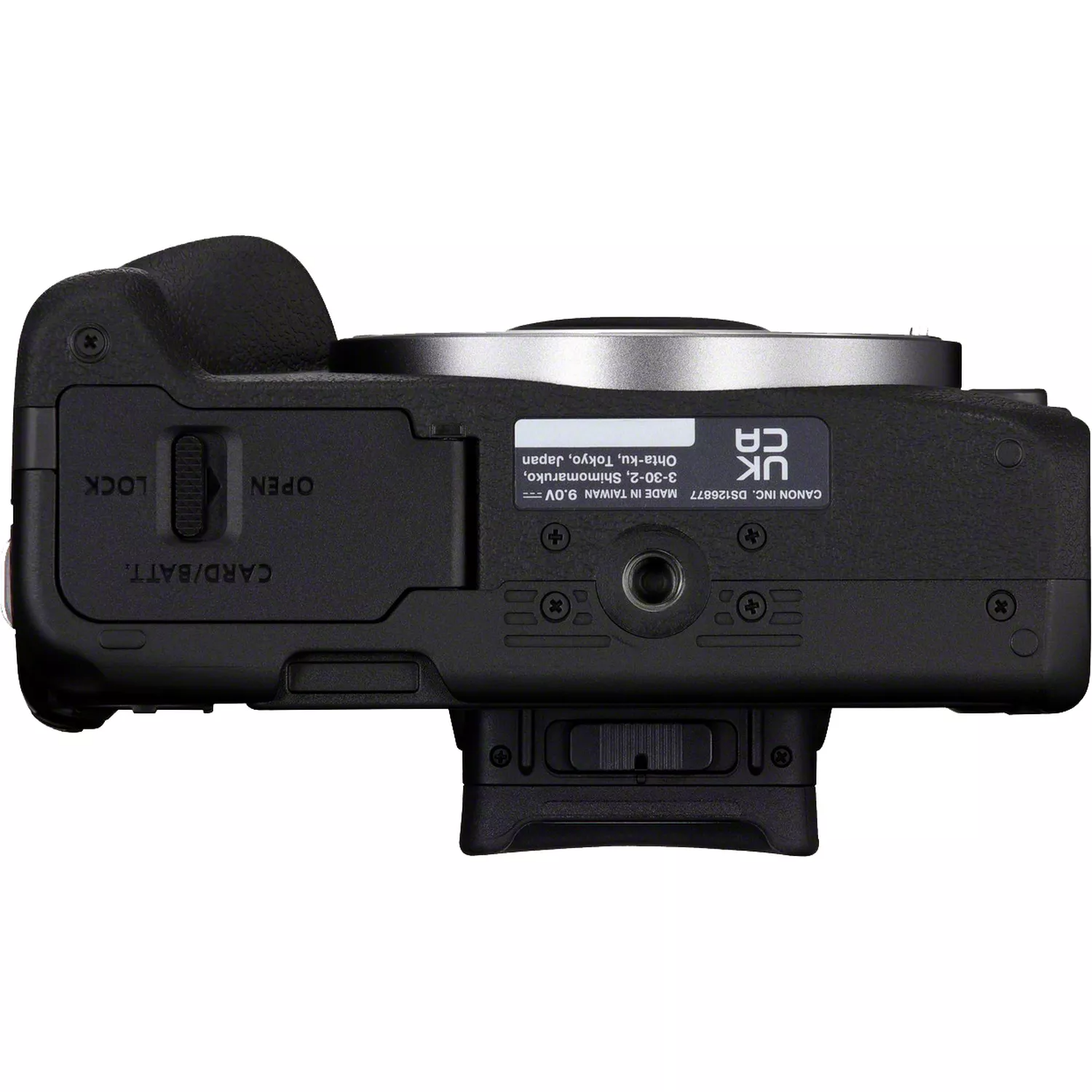 Black camera, bottom view showing the battery slot and labels.