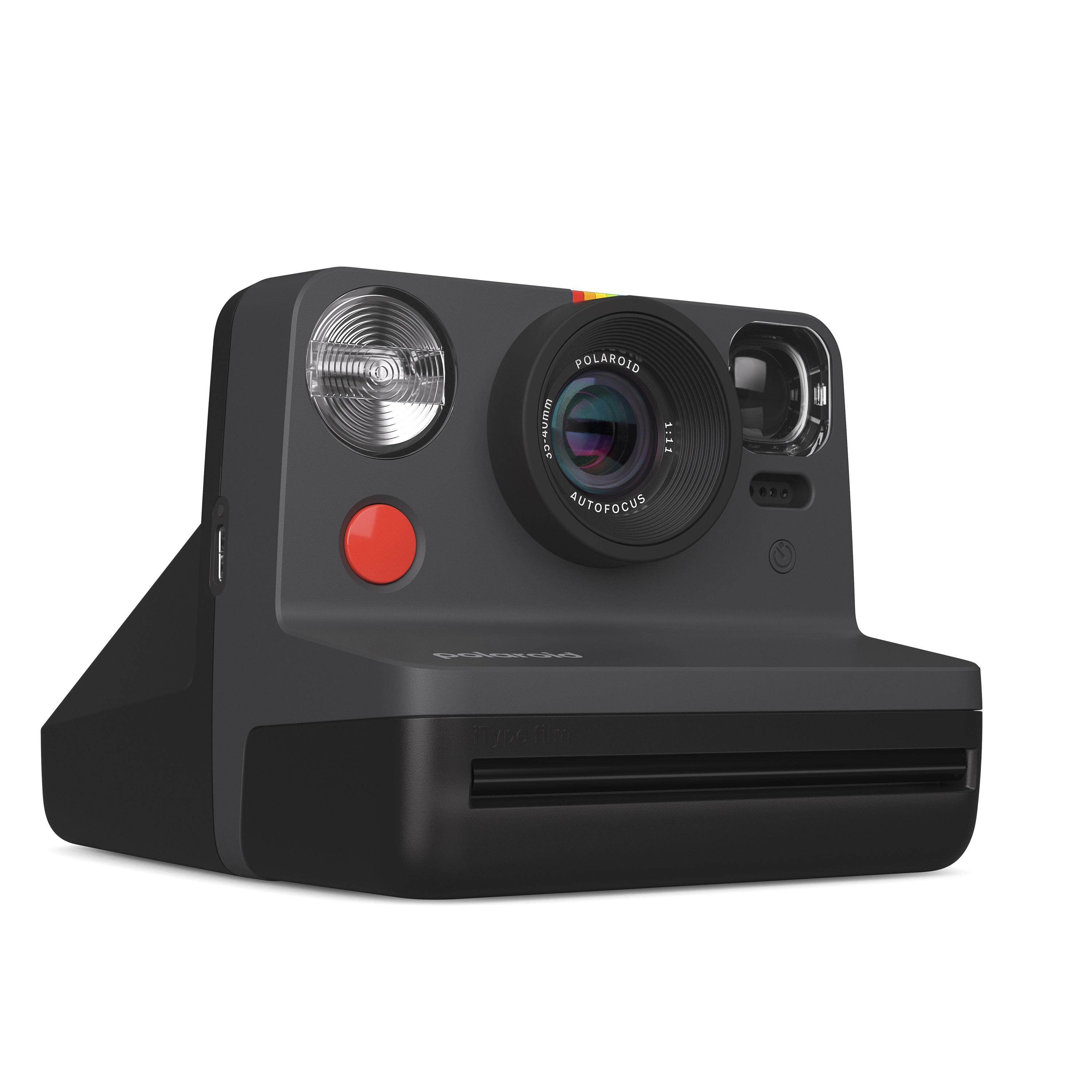 Eine graue Polaroid-Kamera mit rotem Knopf. Sie hat einen Blitz und ein Objektiv, und das Polaroid-Logo ist sichtbar.
