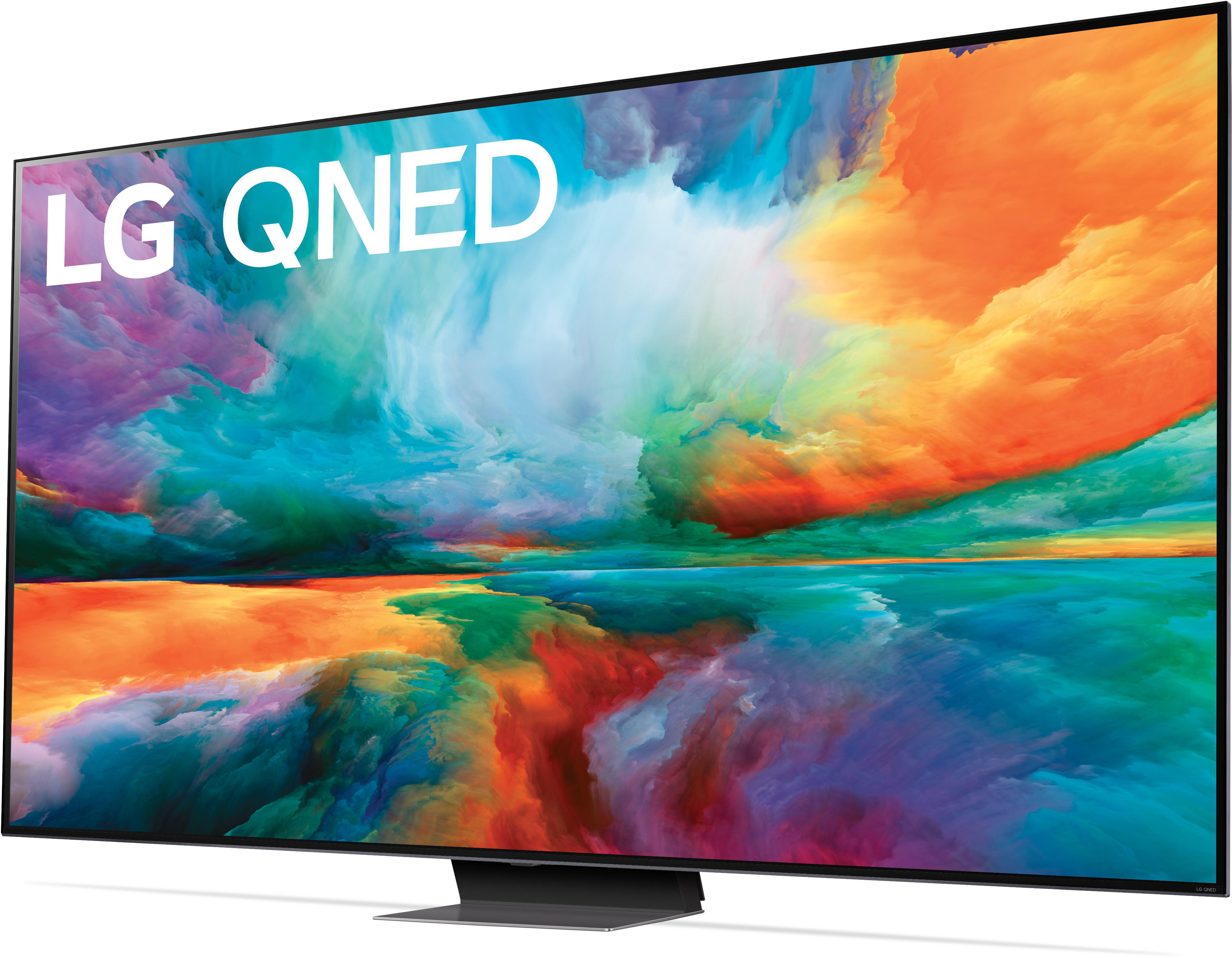 Ein großer LG QNED-TV-Bildschirm mit einem farbenfrohen abstrakten Bild, einem Ständer und dem LG QNED-Logo.