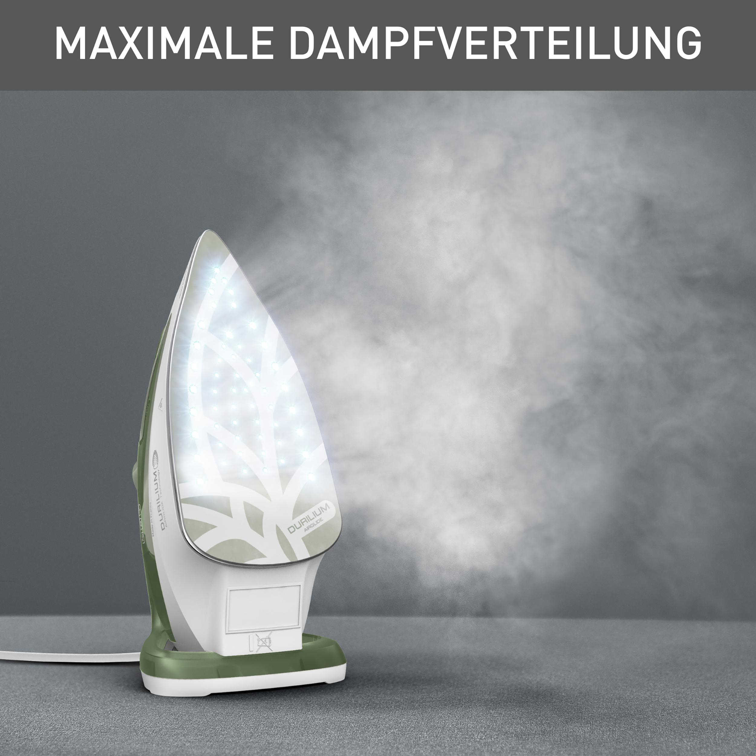 Ein Bügeleisen mit Dampf. Das Bügeleisen ist grün und weiß.