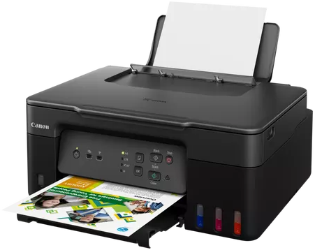 Canon nyomtató papírkimenettel és látható tintapatronokkal.