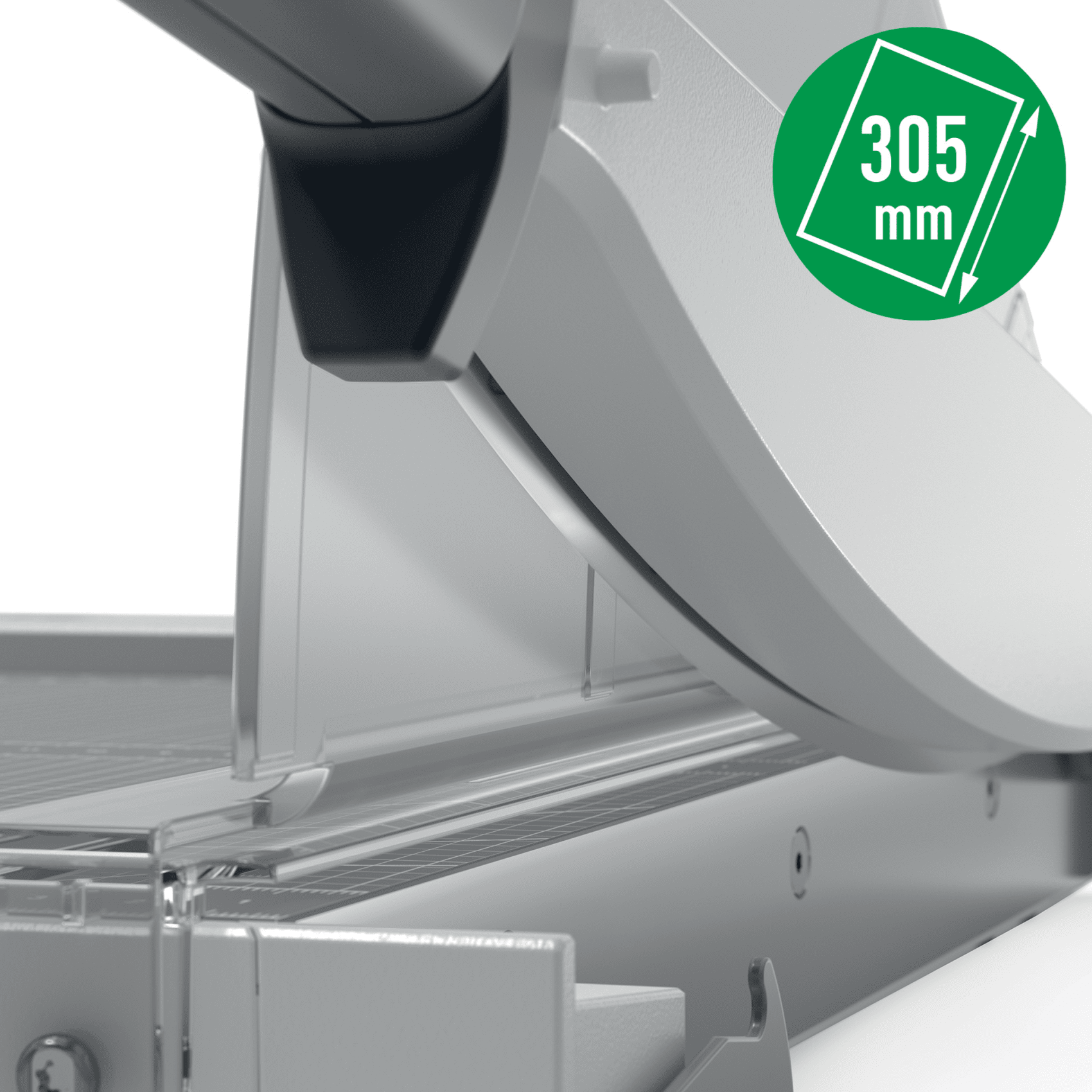 Közelkép egy papírvágóról zöld körrel és a 305 mm számmal.