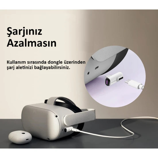 Bir VR başlığı, bir şarj kablosu ve bir şarj dongle'ına bağlıdır, metin şöyledir: Şarjınızın bitmesine izin vermeyin.