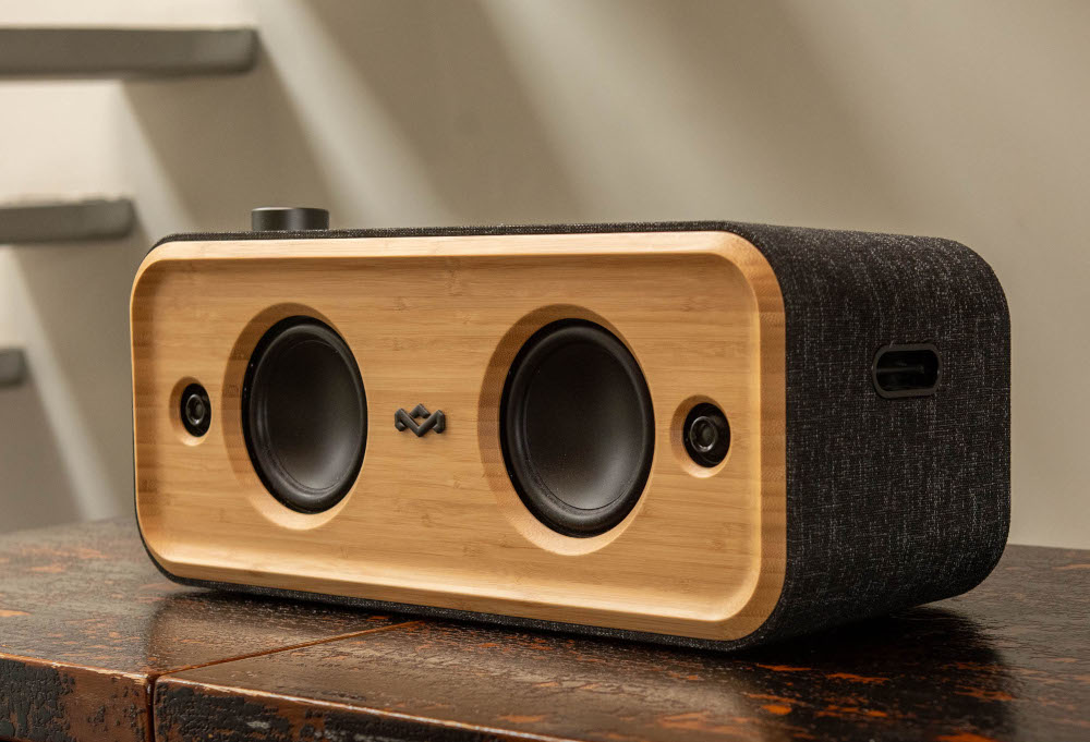 Wooden speaker with two speakers, black fabric, and wood accents.