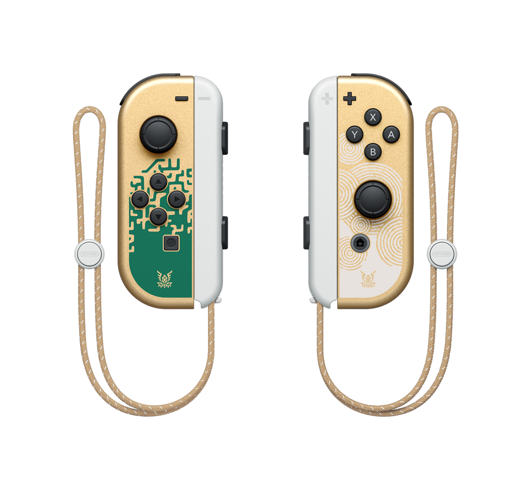Mandos de Nintendo Switch dorados y blancos con diseño verde y dorado, sobre fondo negro.