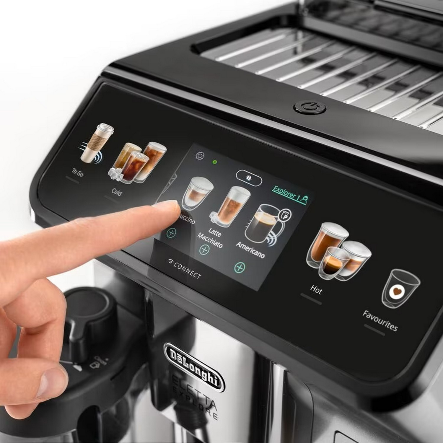 A person's finger touches a coffee machine screen with various coffee options.