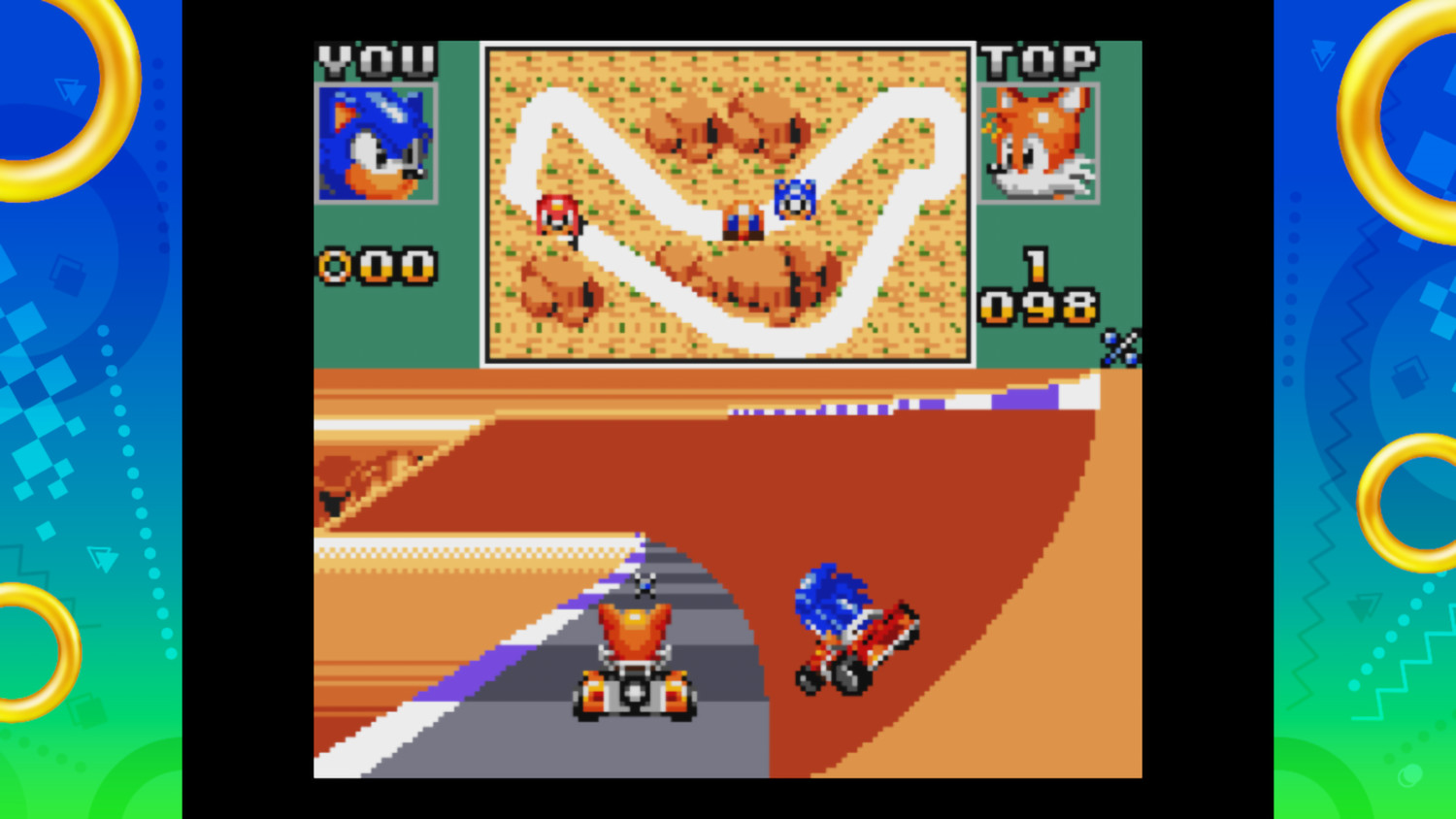 Sonic et Tails font la course en karts. Deux écrans affichent la course.