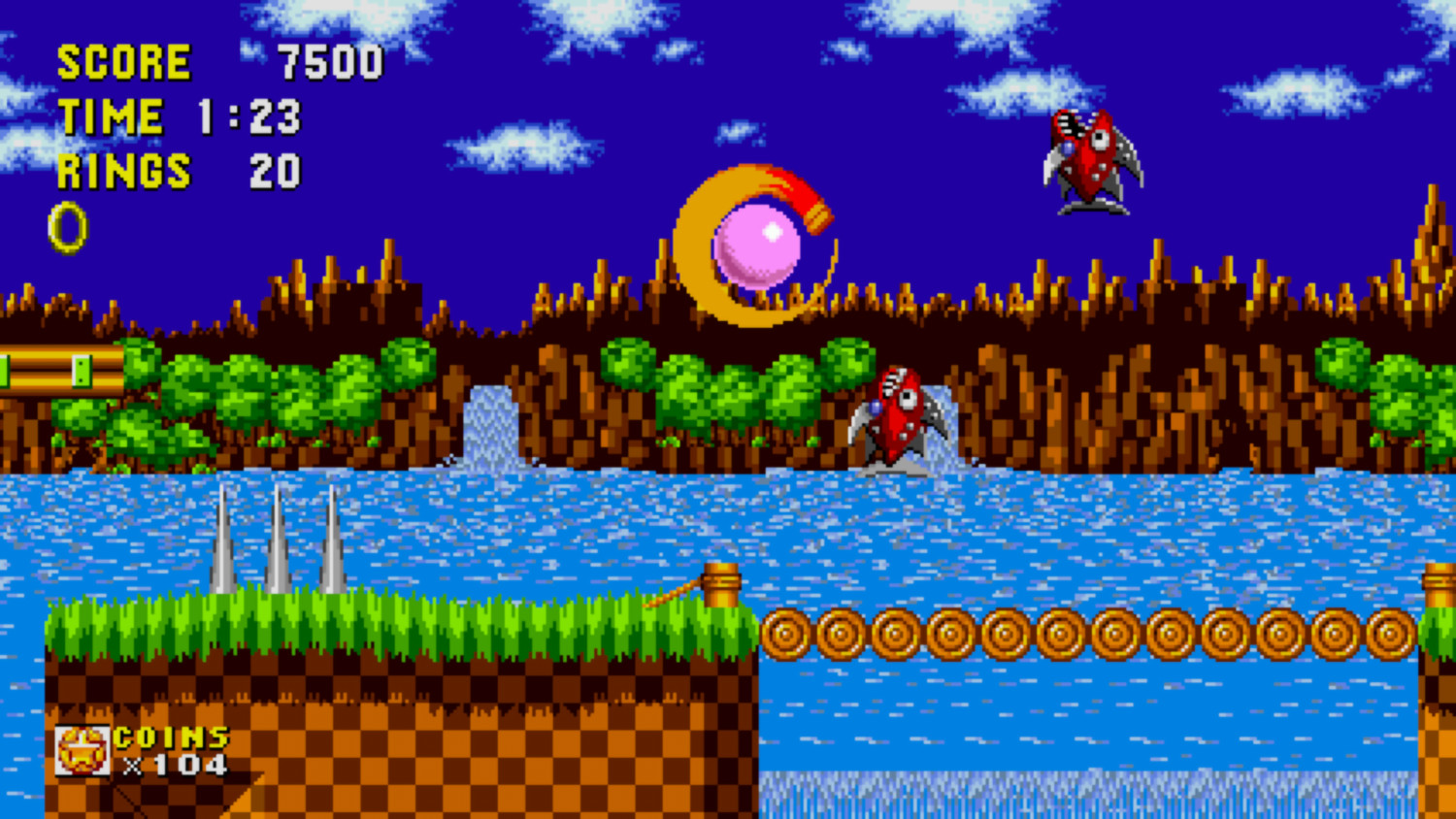 Une scène de jeu vidéo de Sonic. La scène affiche le score, le temps et les anneaux.