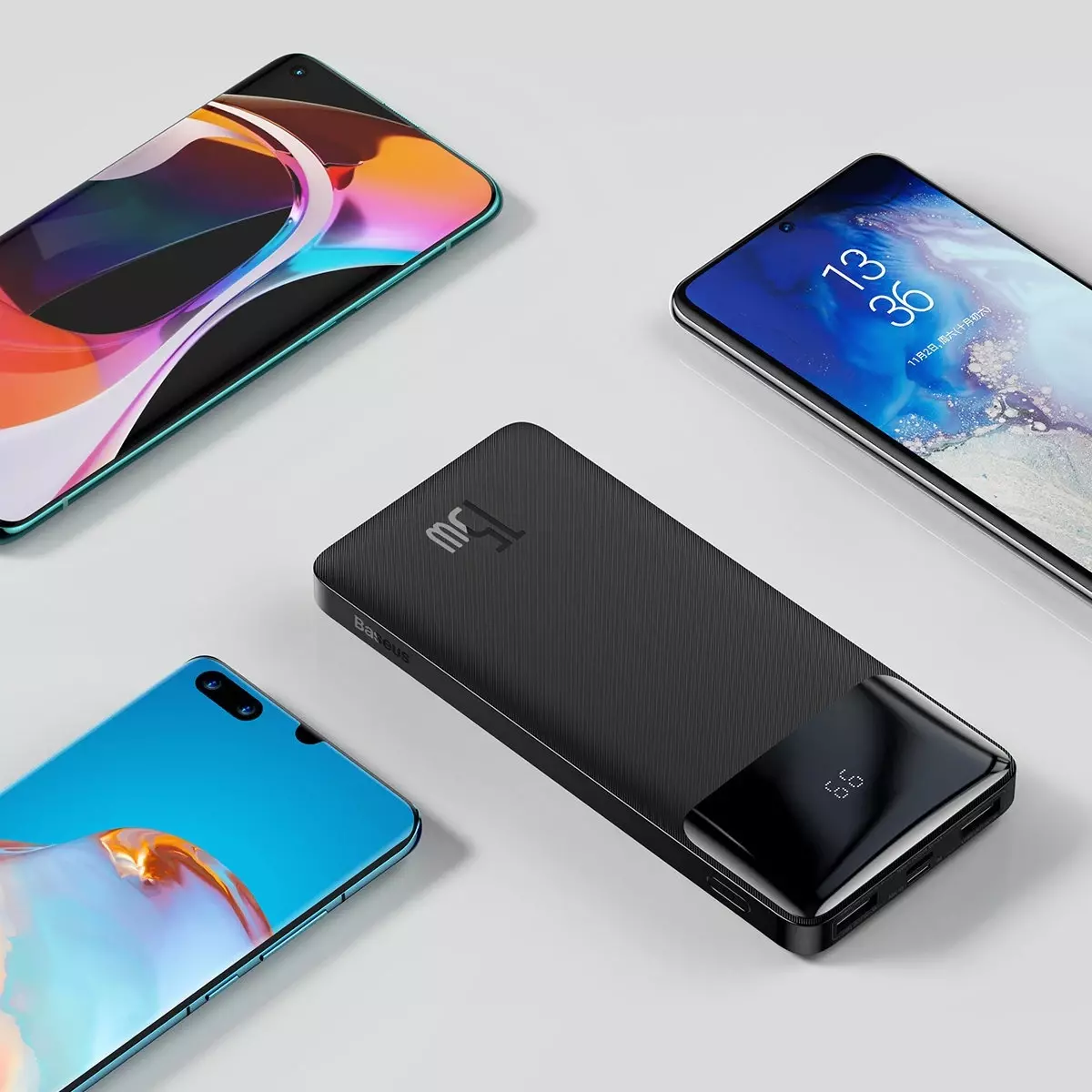 Siyah bir güç bankasını çevreleyen çeşitli akıllı telefonlar.