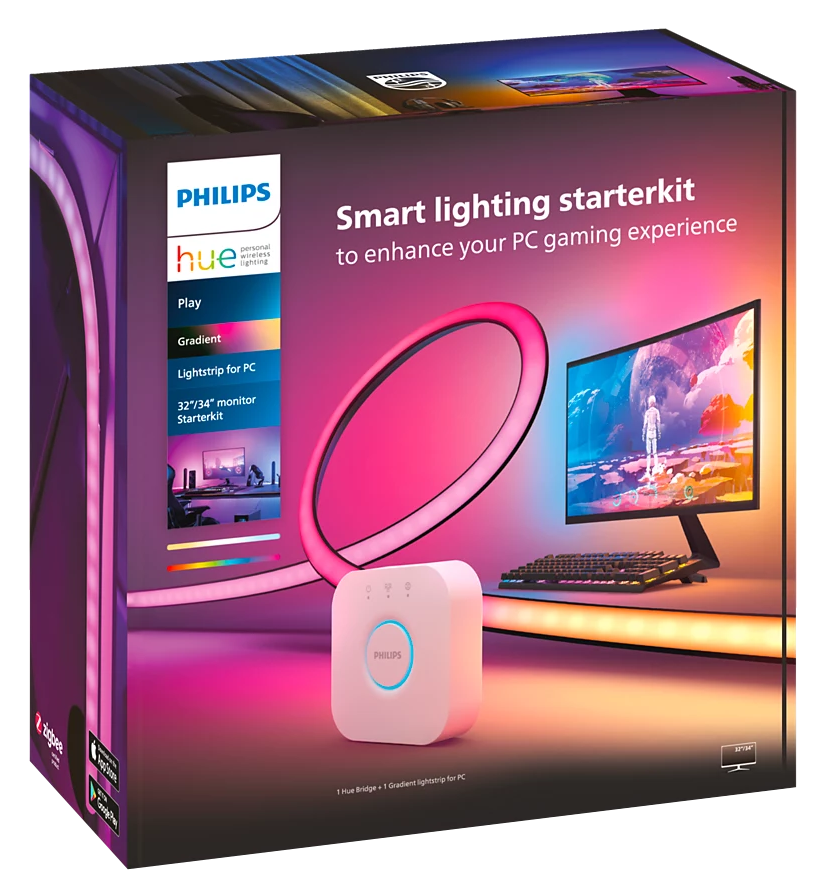 Philips Hue világítás doboz, monitorral, billentyűzettel és fénysávokkal. Fekete háttér.