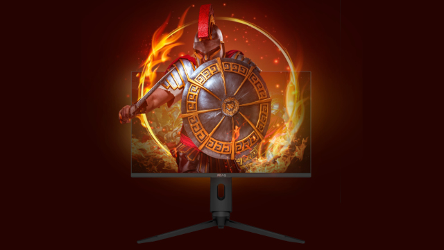 Egy játékmonitor egy spártai harcost jelenít meg tűzben, tüzes vörös háttér előtt.