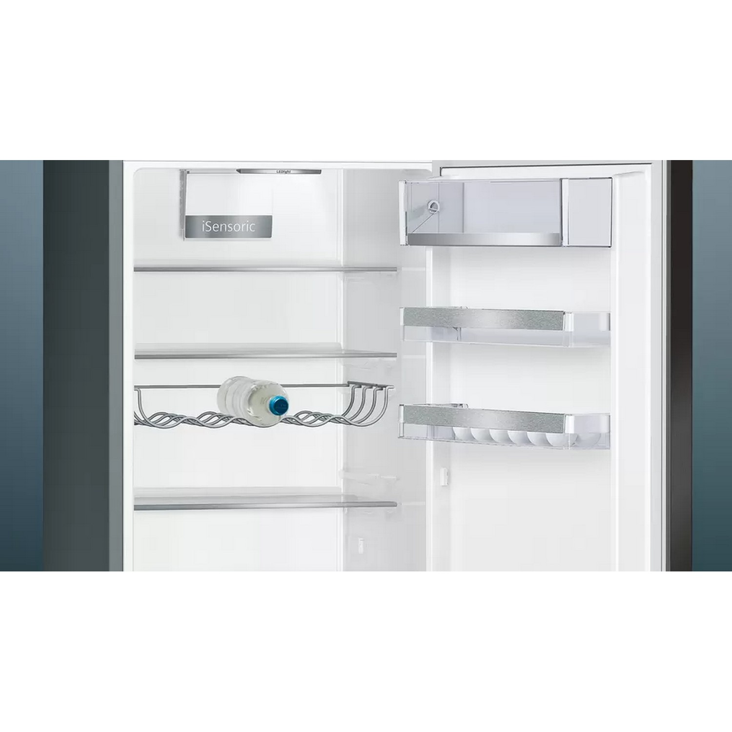 Inside of a refrigerator with shelves, a water bottle, and drawers. White interior.