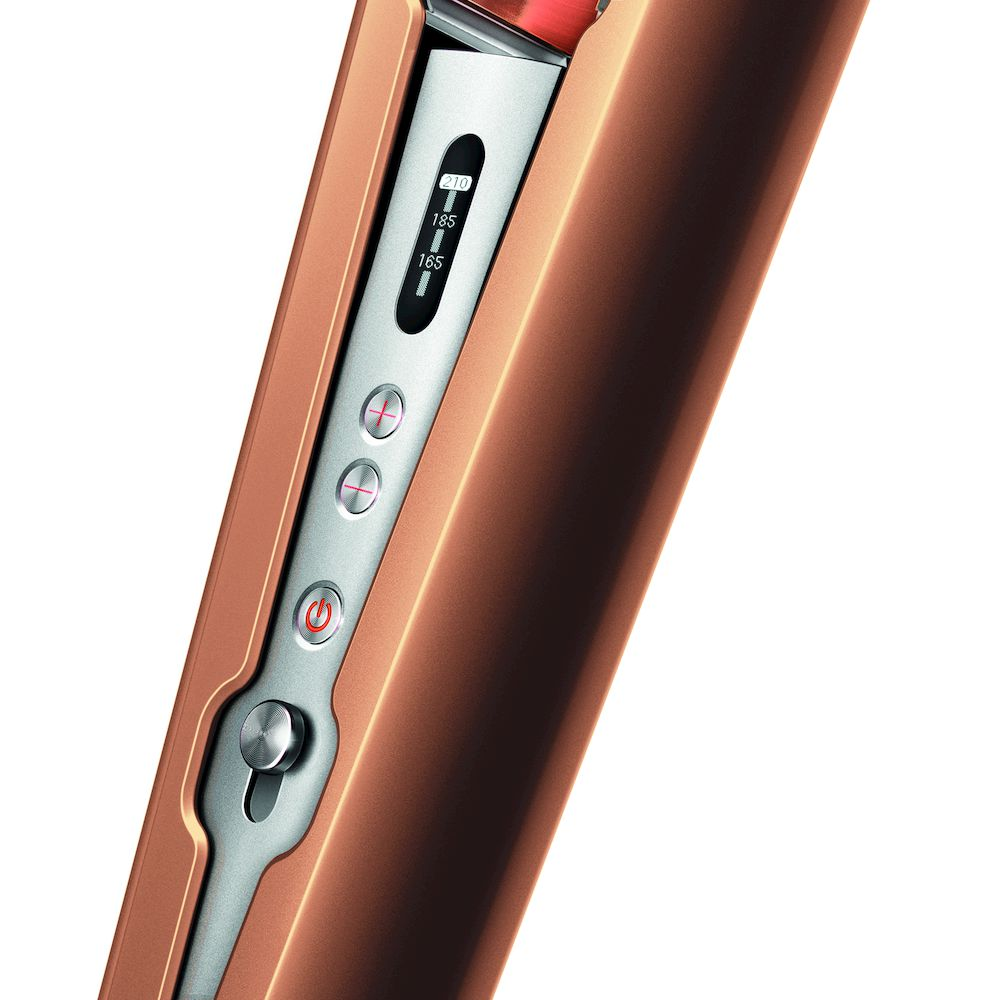 Primer plano de una plancha de pelo color cobre con ajustes de temperatura y botones de control.